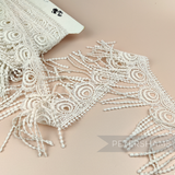 Petershams Millinery Supplies vintage 1990s ivory guipure lace trim with a 12.5cm wide peacock feather fringe design.