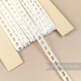 Petershams Millinery Supplies vintage 7mm ivory cotton ribbon slot lace on a card for sewing and craft projects.
