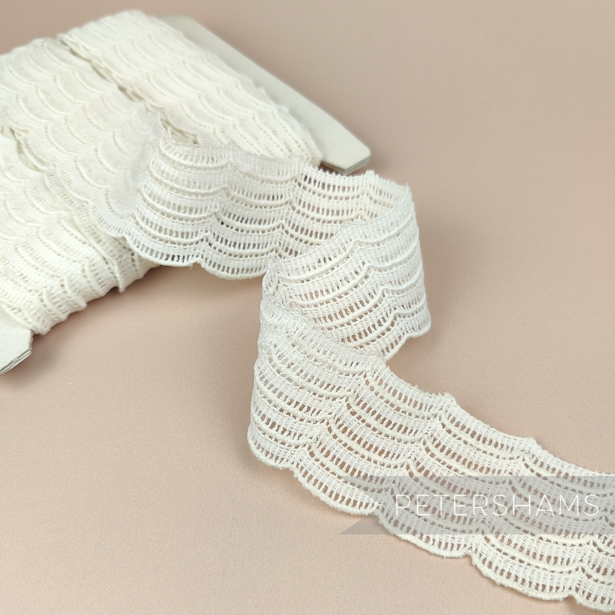 Petershams Millinery Supplies vintage 1950s ivory cotton guipure lace trim with a fine woven wave pattern