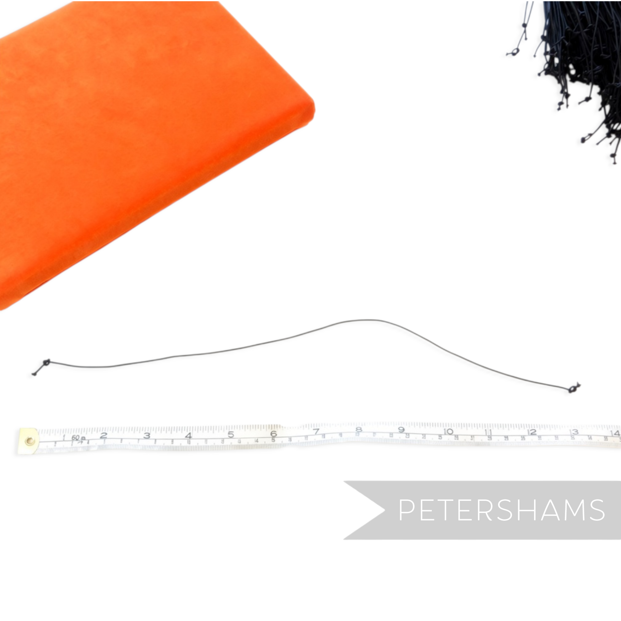 Petershams Millinery Supplies black knotted 1.5mm hat elastic measured against a tape measure on a white background