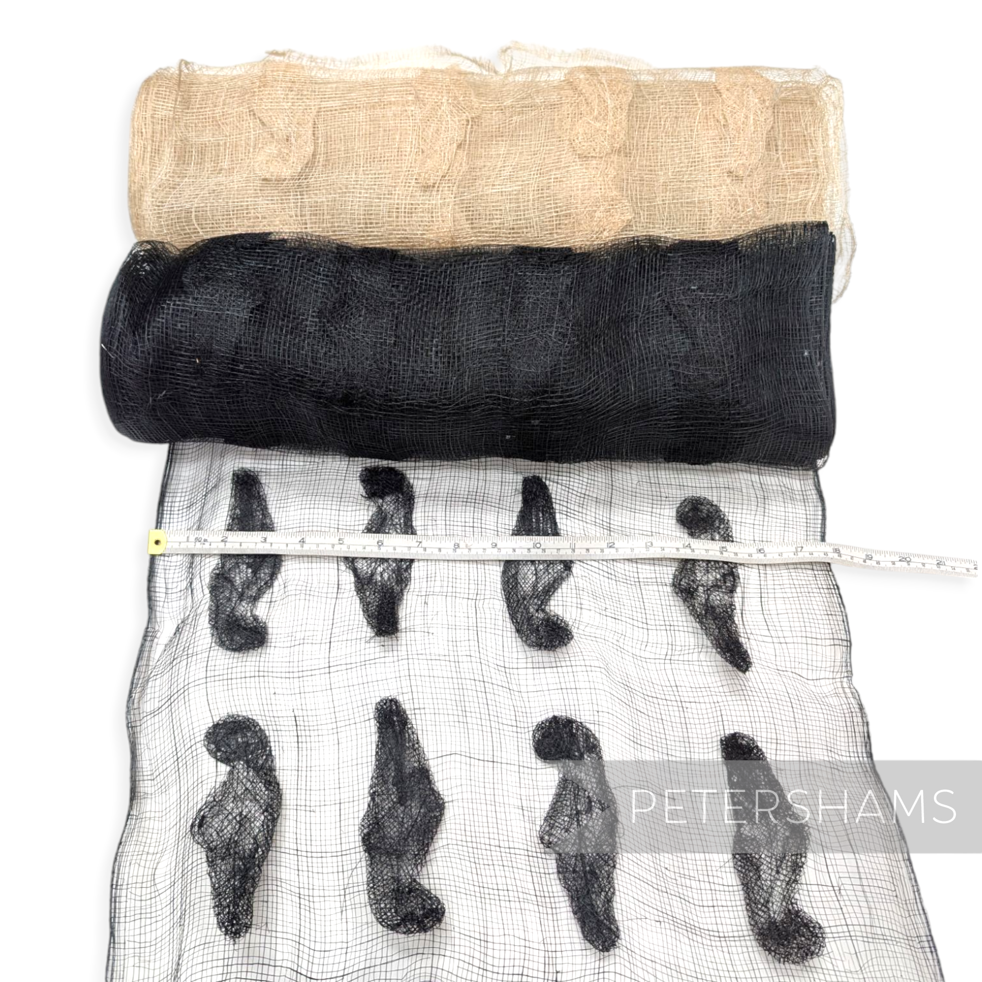 Petershams Millinery Supplies sinamay fabric with black leaf applique and natural beige roll on white background