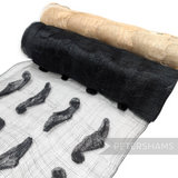 Petershams Millinery Supplies black and natural sinamay fabric rolls with soft rounded leaf applique detailing.