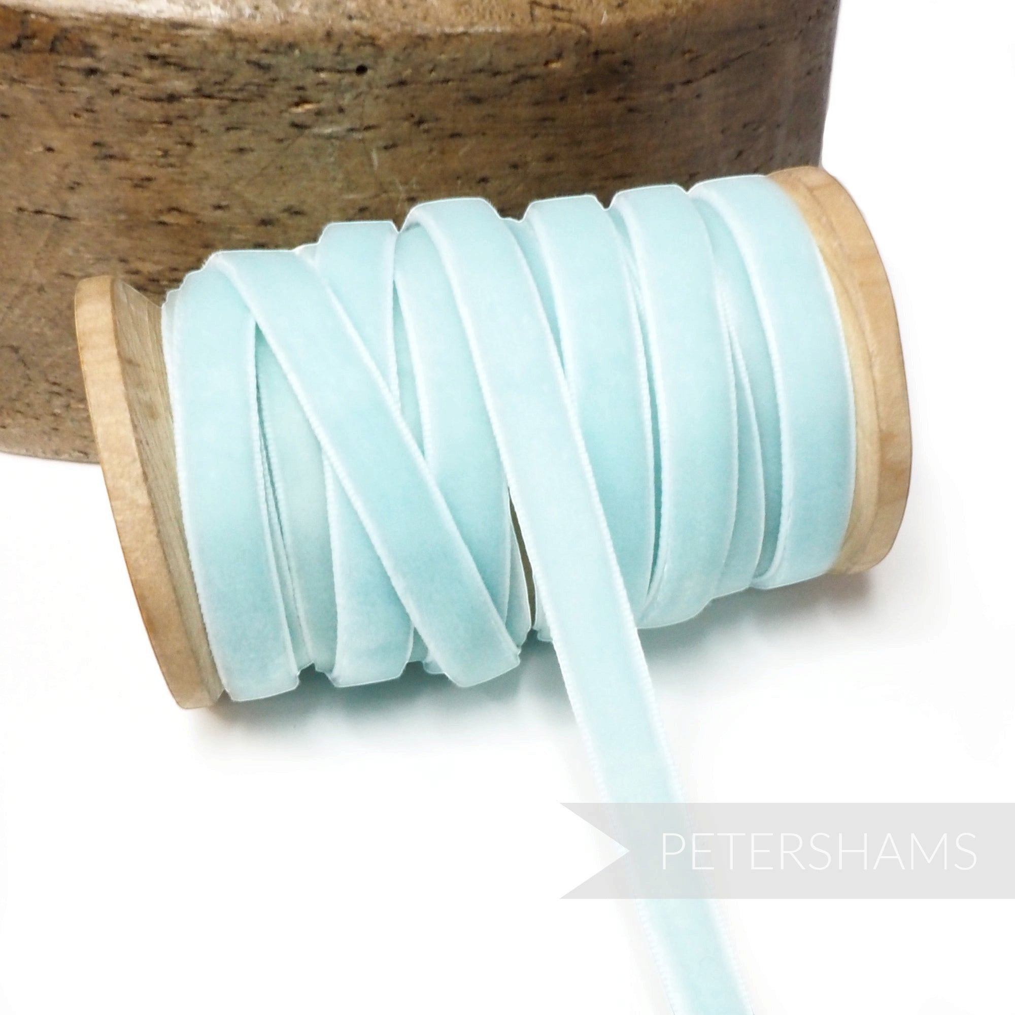 Petershams Millinery Supplies 9mm wide vintage pale blue rayon velvet ribbon on a wooden spool