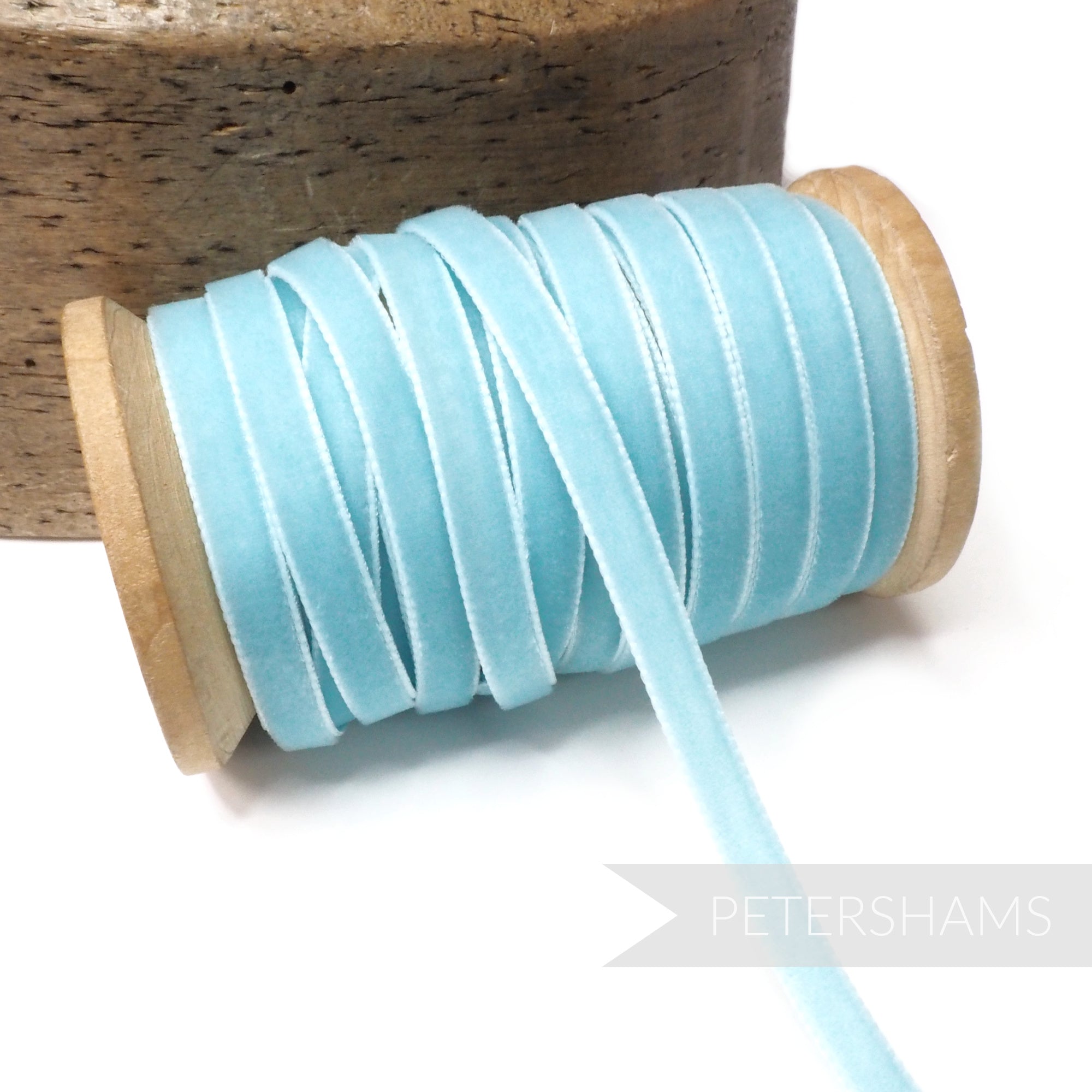 Petershams Millinery Supplies 7mm light blue vintage rayon velvet ribbon on a wooden spool