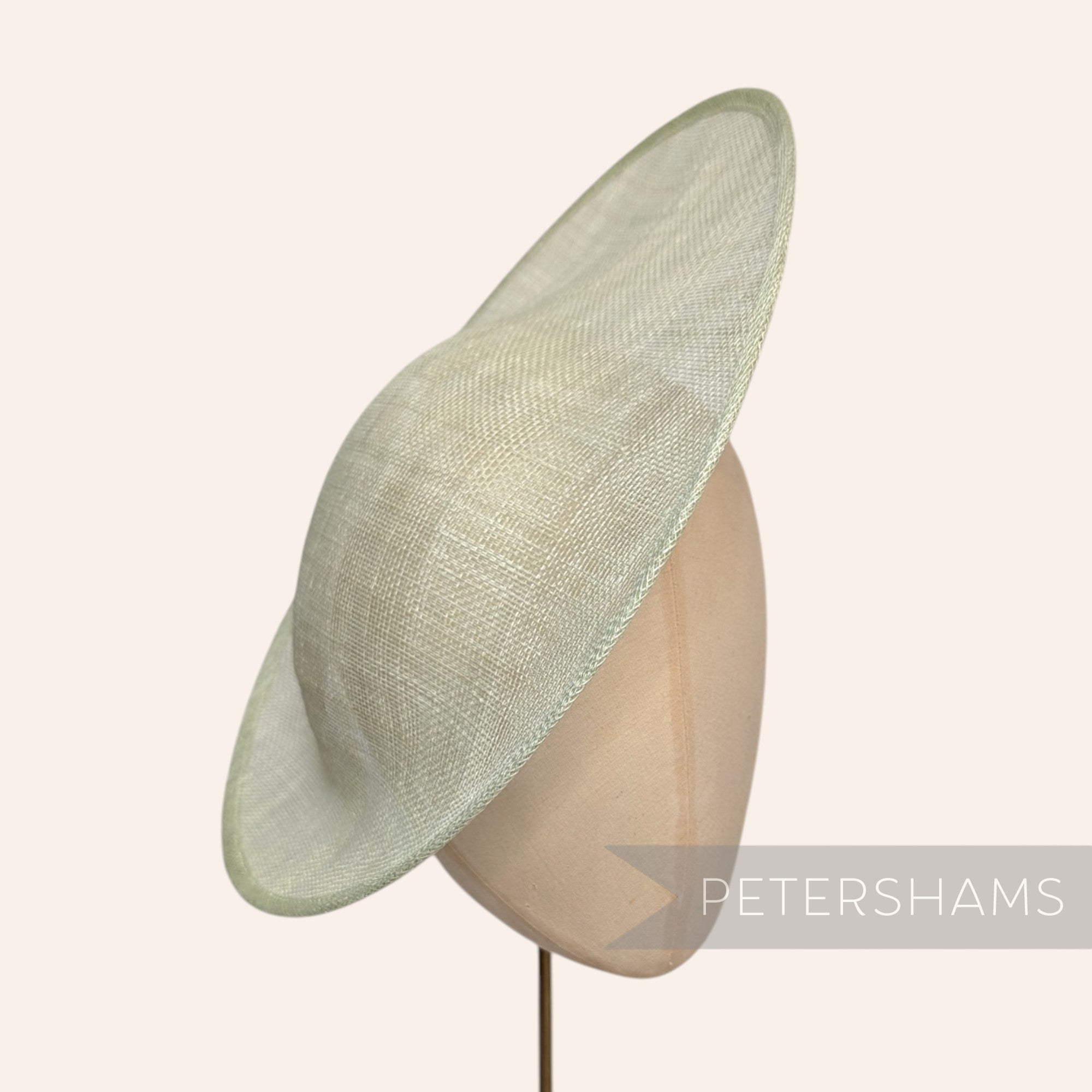 Petershams Millinery Supplies Maggie large oval sinamay fascinator hat base in a mint green colour.