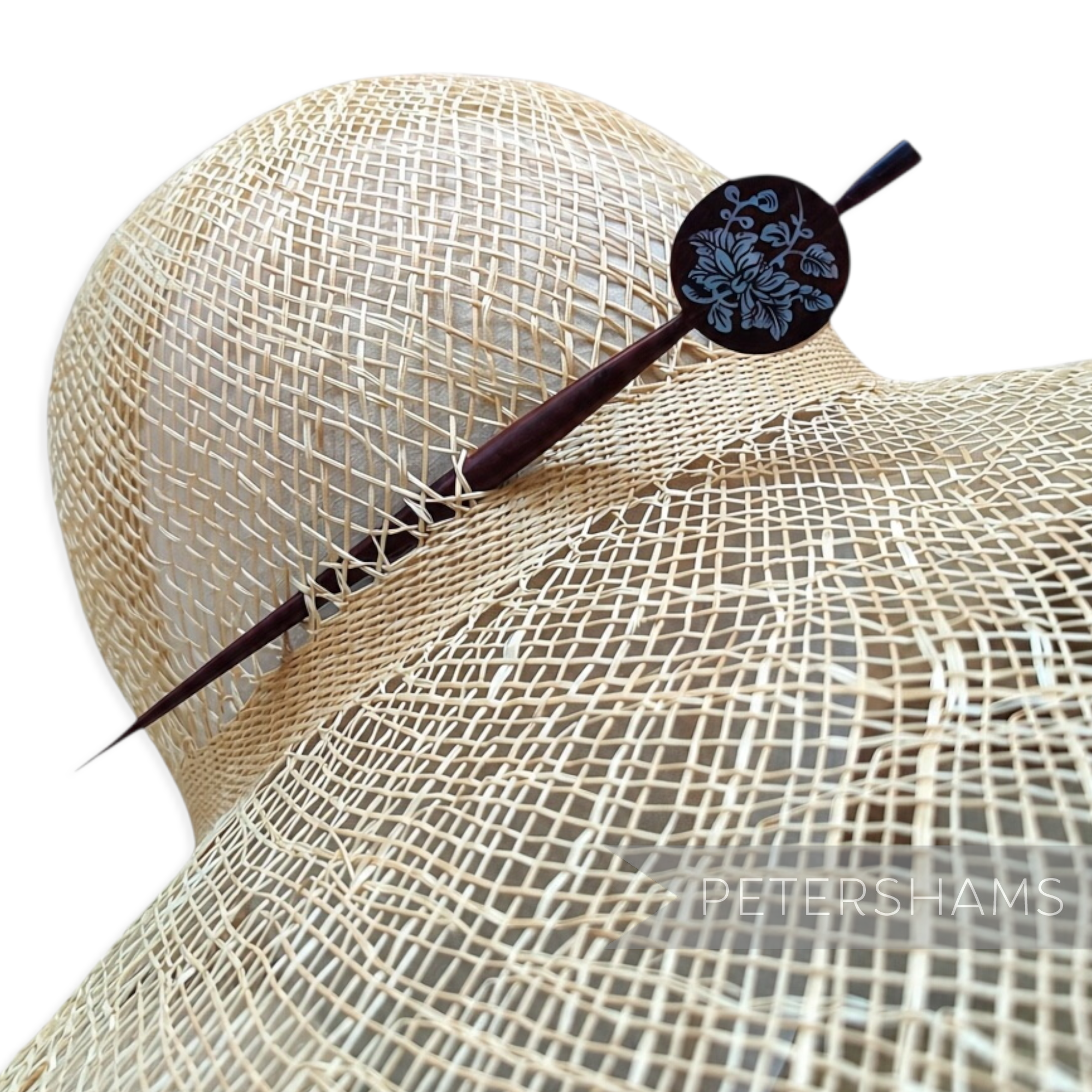 Petershams Millinery Supplies vintage mahogany wood hat pin with mother-of-pearl floral inlay on a straw hat