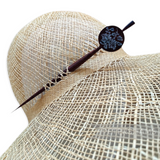 Petershams Millinery Supplies vintage mahogany wood hat pin with mother-of-pearl floral inlay on a straw hat