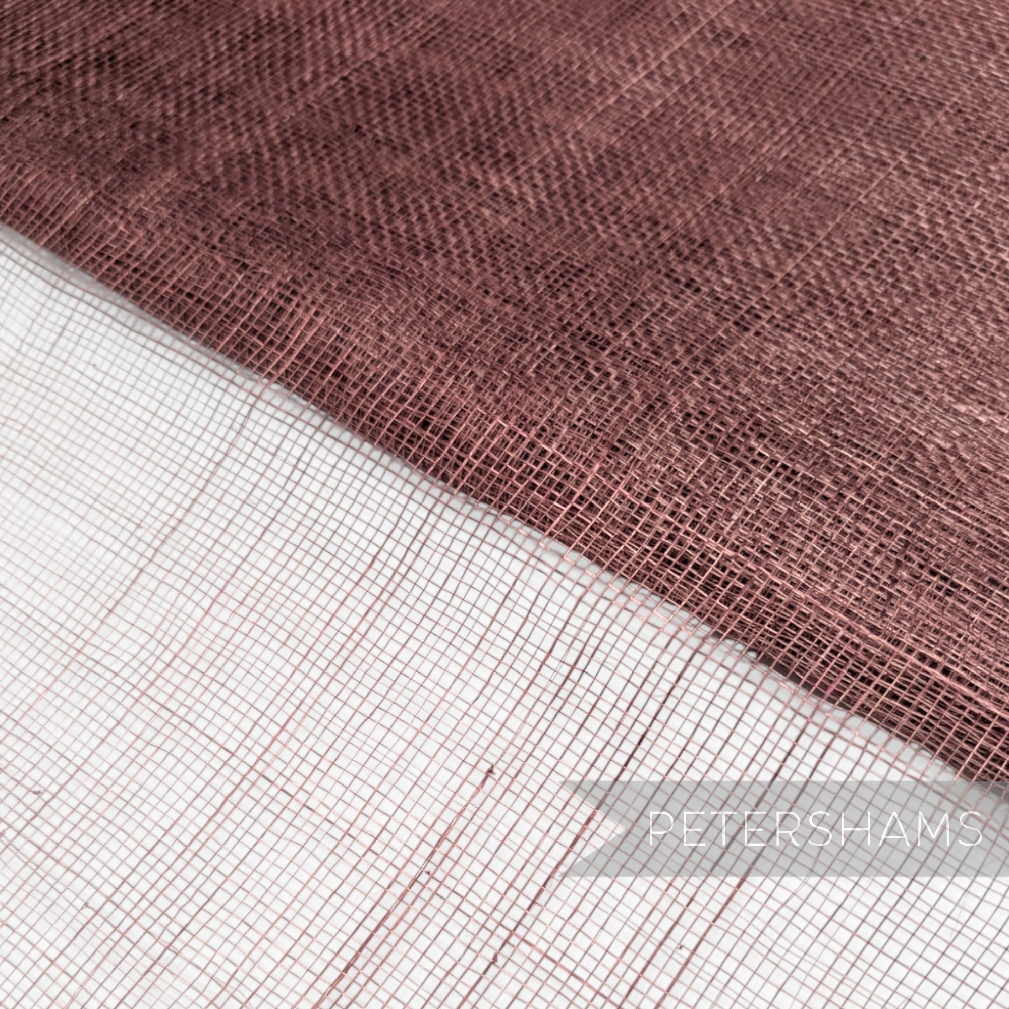 Petershams Millinery Supplies open weave sinamay abaca fabric in a deep rose pink shade for hat making