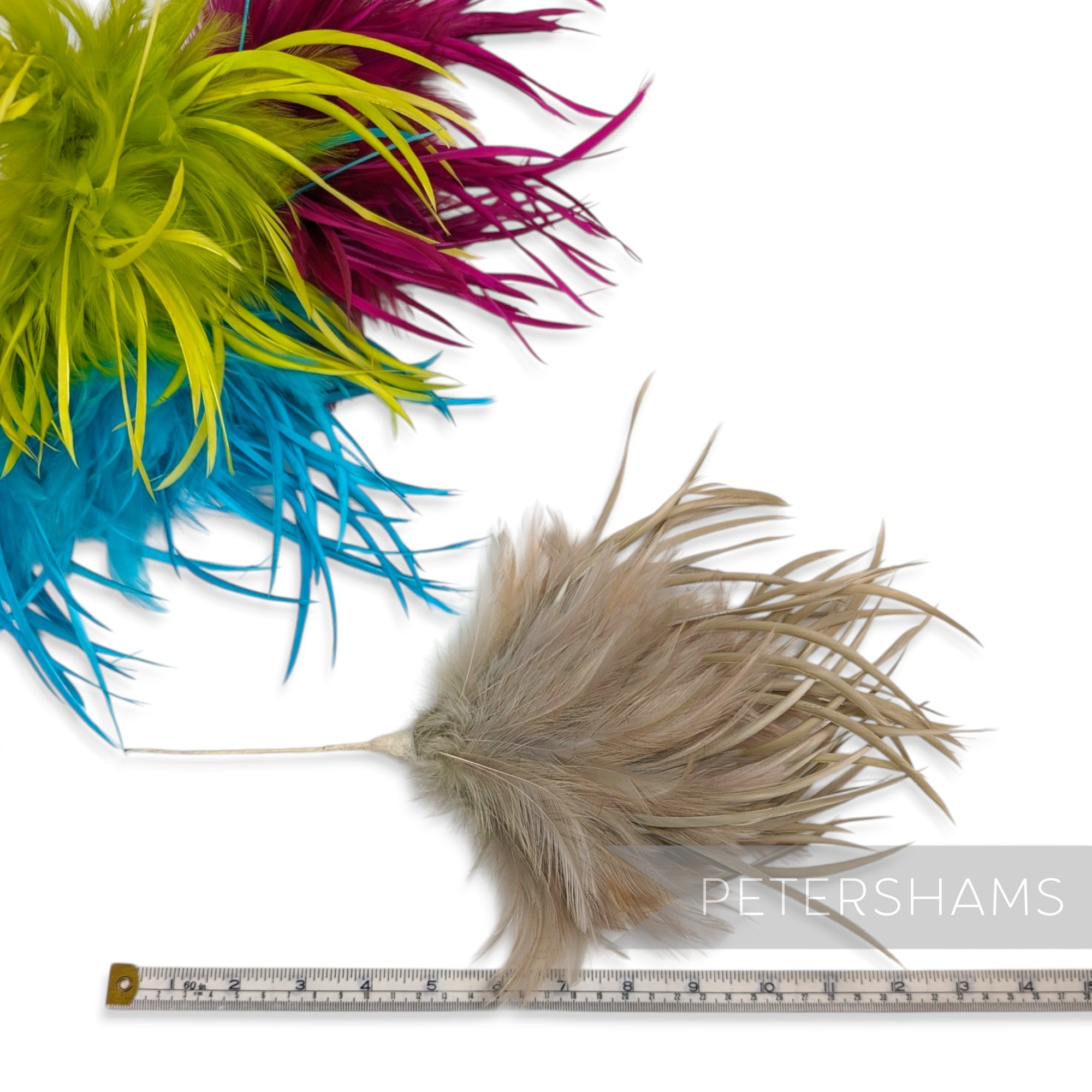 Petershams Millinery Supplies mega fluffy hackle and goose biot feather hat mounts in vibrant green, pink, blue, and tan.