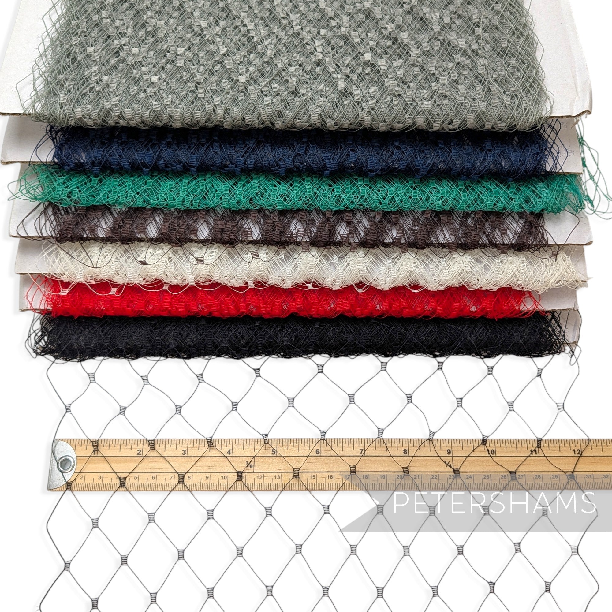 Petershams Millinery Supplies English merry widow veiling in various colors with a 3cm wide diamond pattern on a ruler.