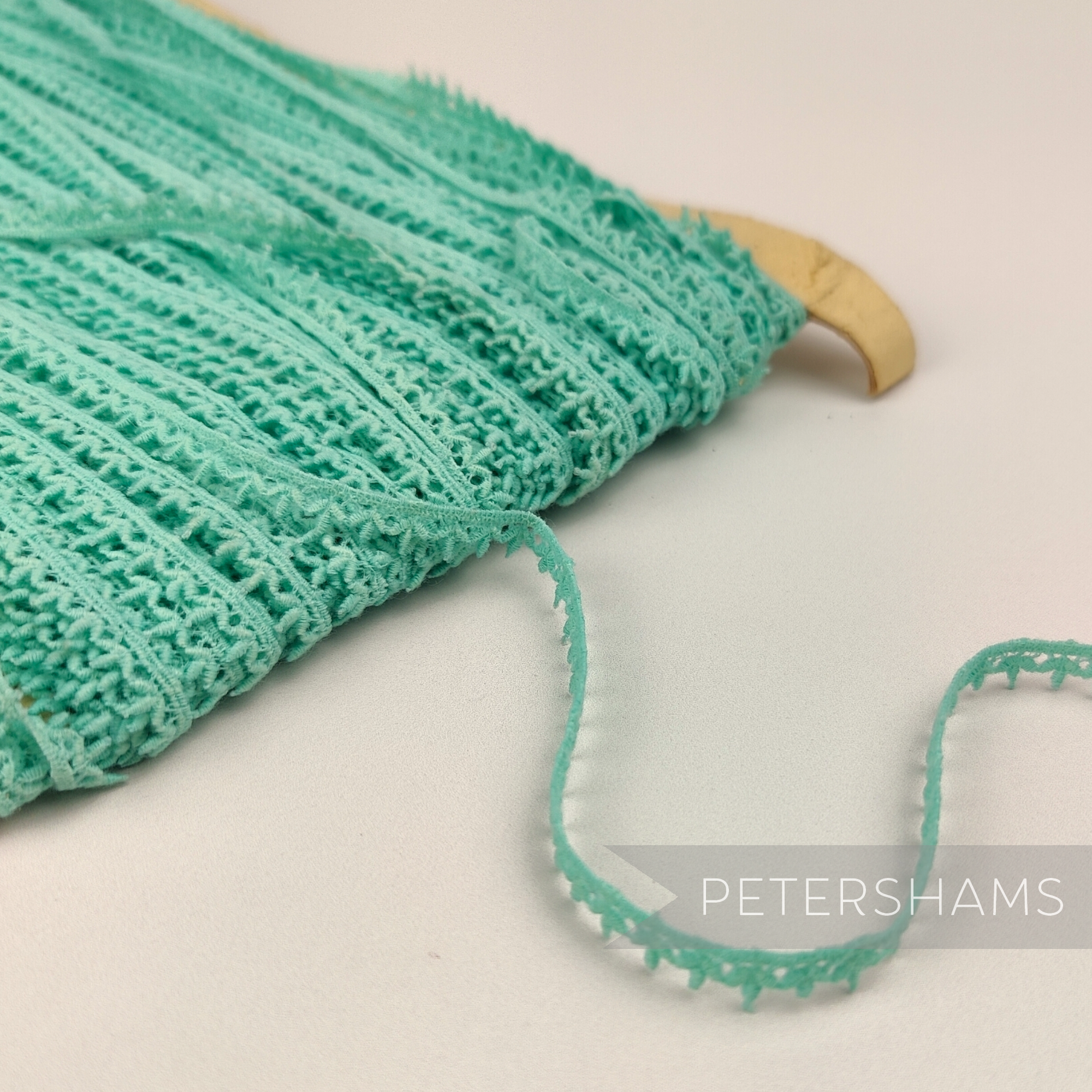 Petershams Millinery Supplies vintage 1950s English cotton guipure lace trim in a delicate mint green leafy design