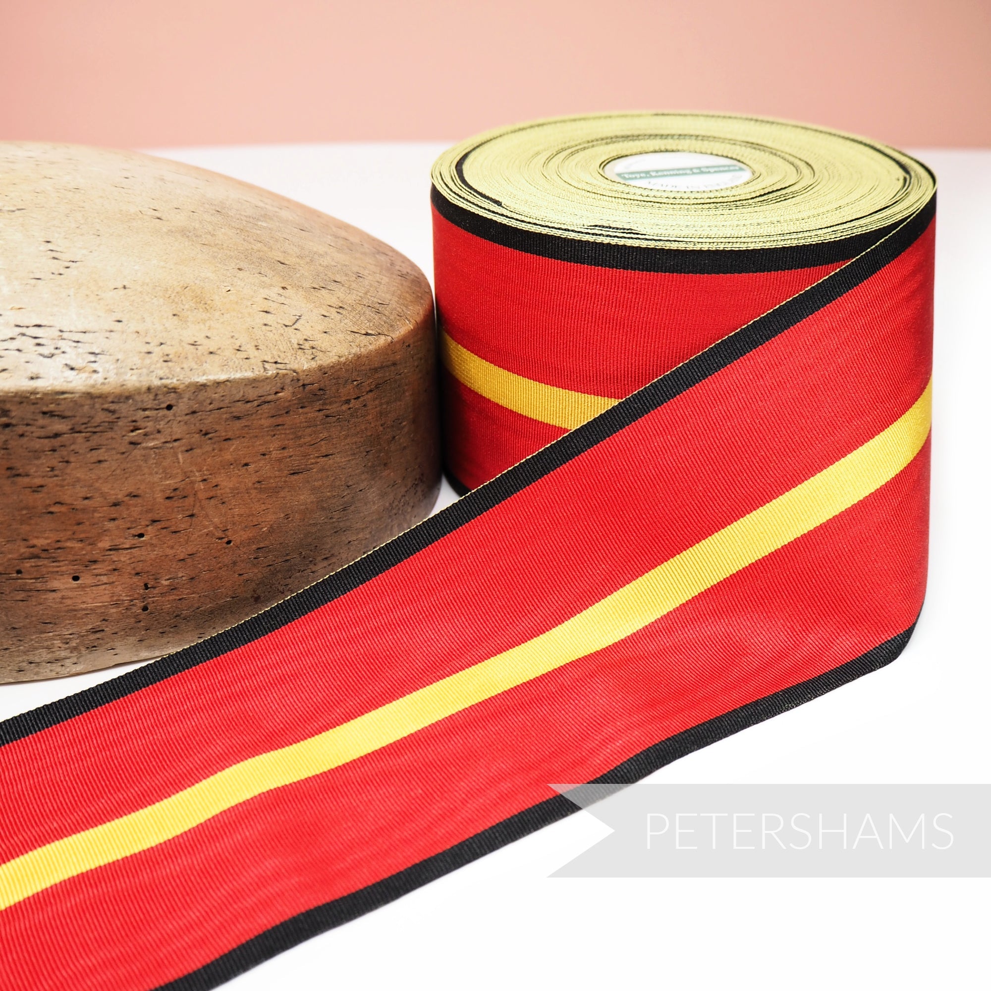 Petershams Millinery Supplies vintage 84mm wide red, yellow, and black moiré striped grosgrain ribbon for hat making.
