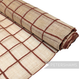 Petershams Millinery Supplies natural sinamay abaca fabric with a brown wool yarn check pattern on a roll.