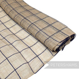 Petershams Millinery Supplies natural sinamay abaca fabric with a navy blue wool yarn square check pattern