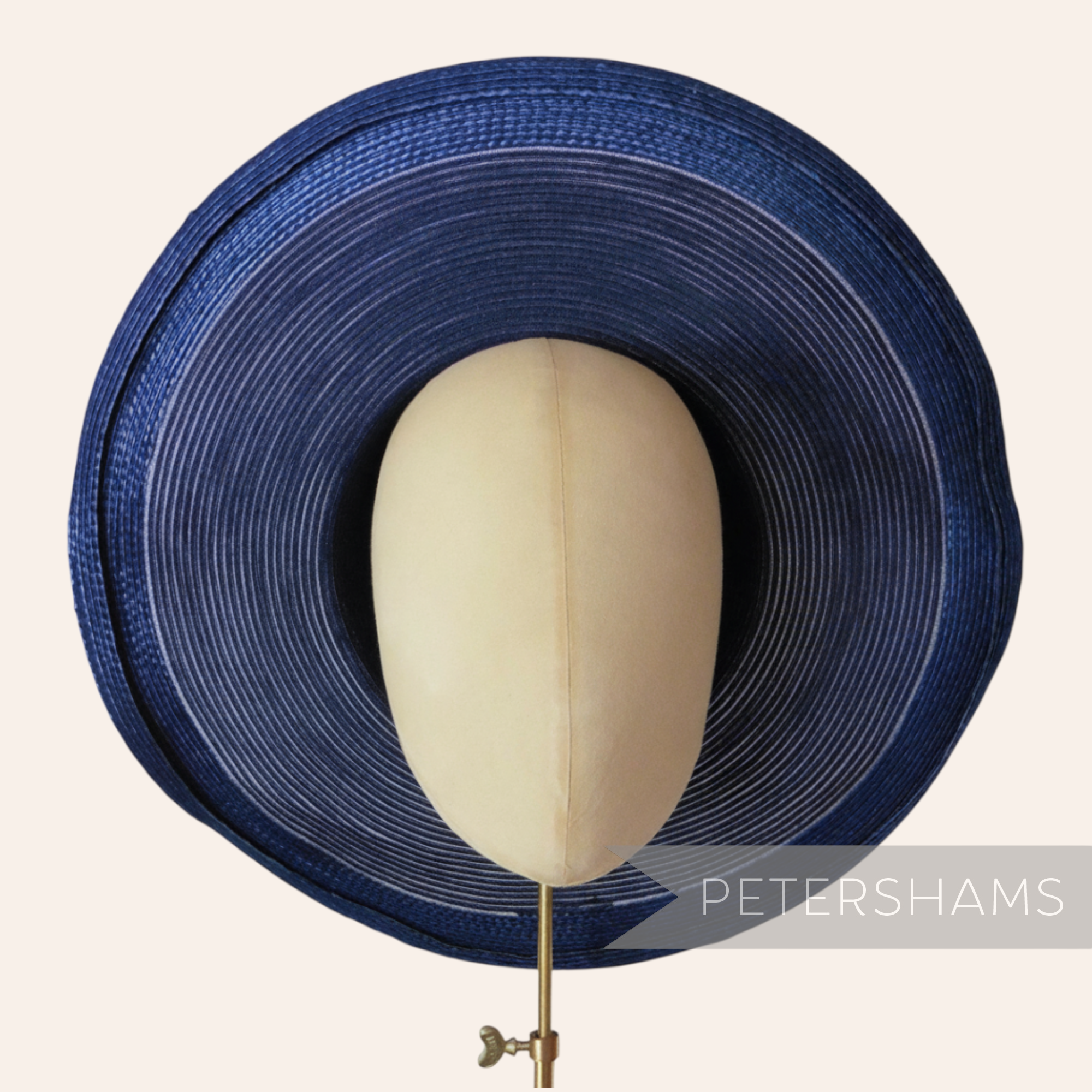 Petershams Millinery Supplies navy blue cotton threaded capeline hat body with a shiny polybraid edge
