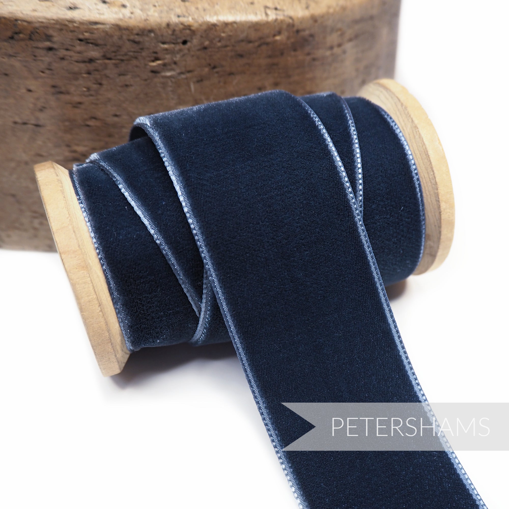 Petershams Millinery Supplies 36mm slate blue French velvet ribbon on a wooden spool with a luxurious sheen