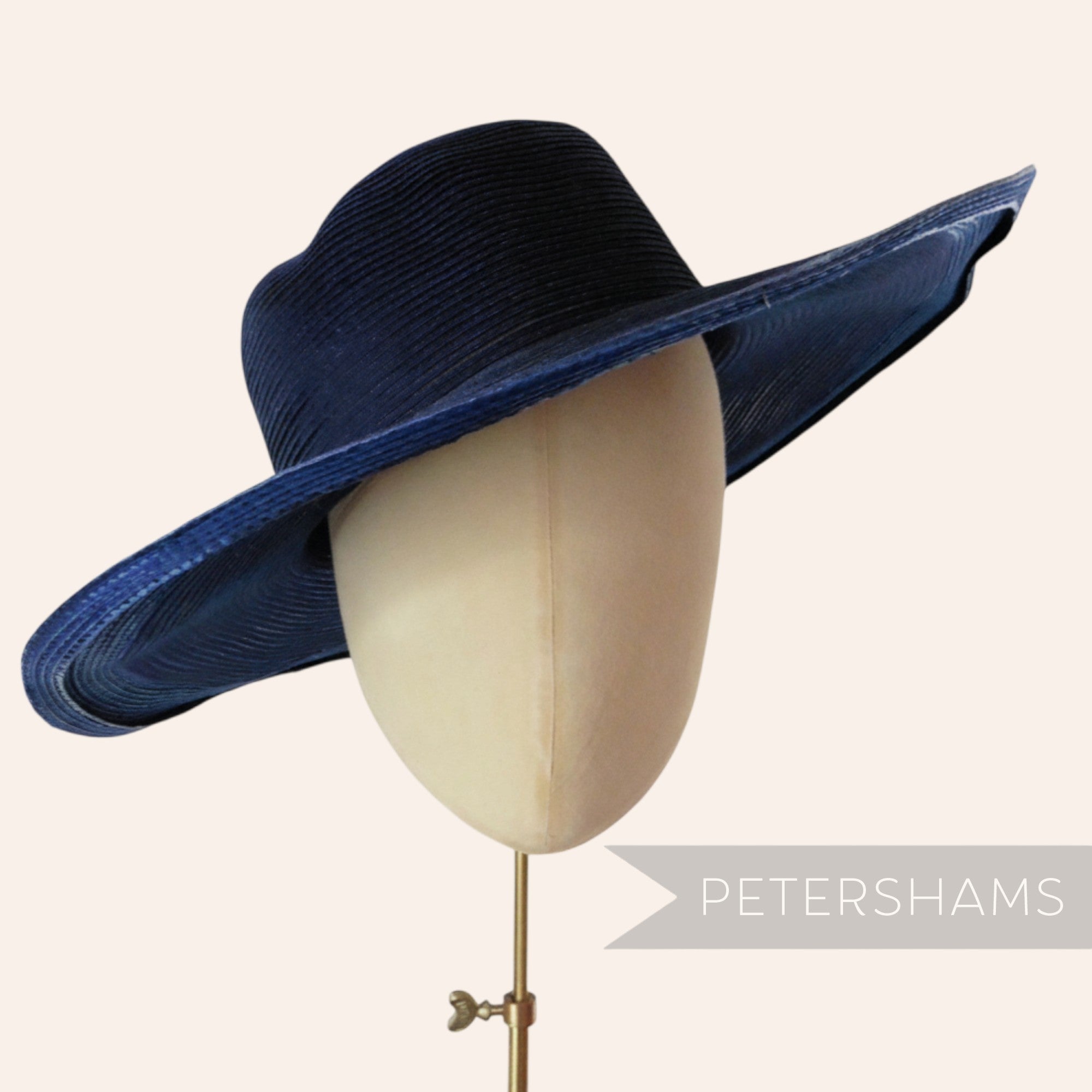 Petershams Millinery Supplies navy blue cotton threaded capeline hat body with a shiny polybraid edge