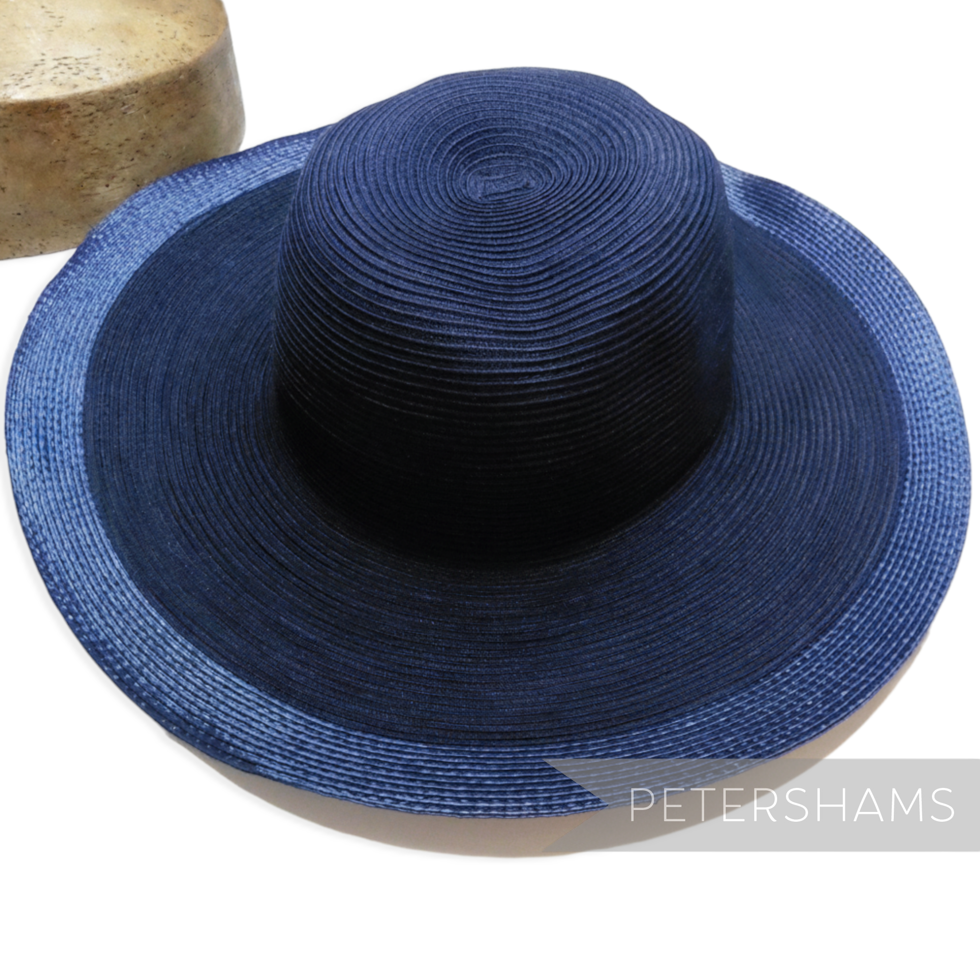 Petershams Millinery Supplies navy blue cotton threaded capeline hat body with a shiny polybraid edge