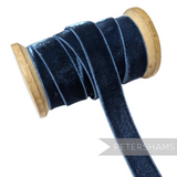 Petershams Millinery Supplies 16mm navy blue elastic stretch velvet ribbon on a wooden spool for millinery projects.