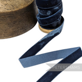 Petershams Millinery Supplies 16mm elastic stretch velvet ribbon in dark blue on a wooden spool