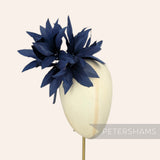 Petershams Millinery Supplies Kay navy blue goose feather pom flower hat mount on a mannequin head