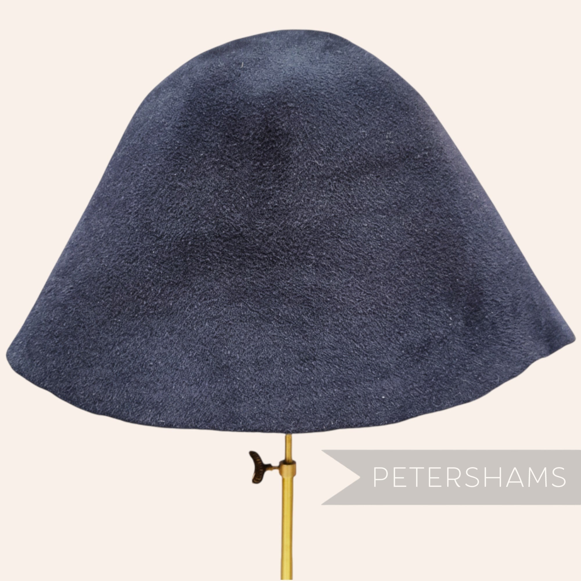 Petershams Millinery Supplies extra large dark navy double faced peachbloom fur felt cone hat body on a stand