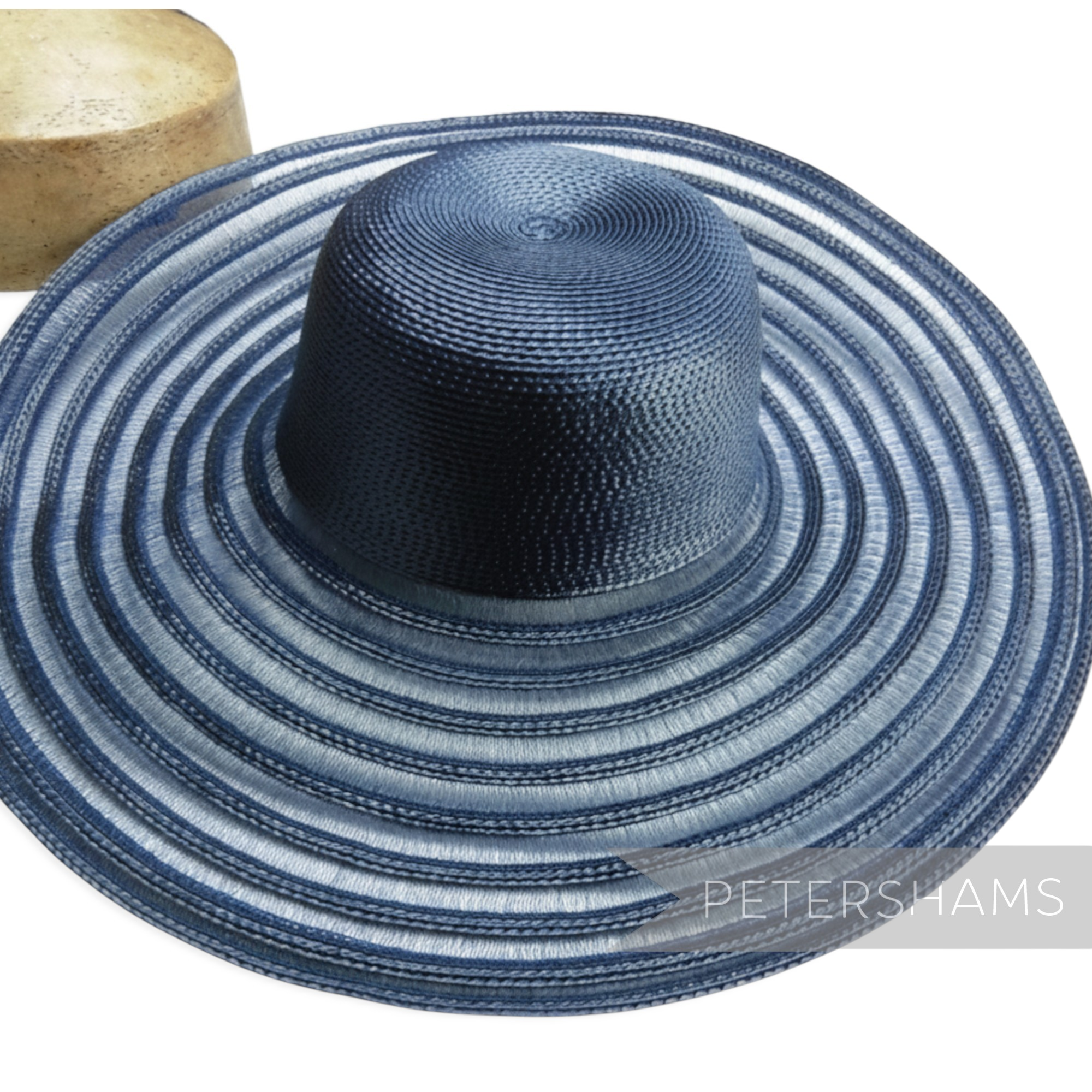 Petershams Millinery Supplies navy blue polybraid capeline hat body with a wide striped crin brim for millinery