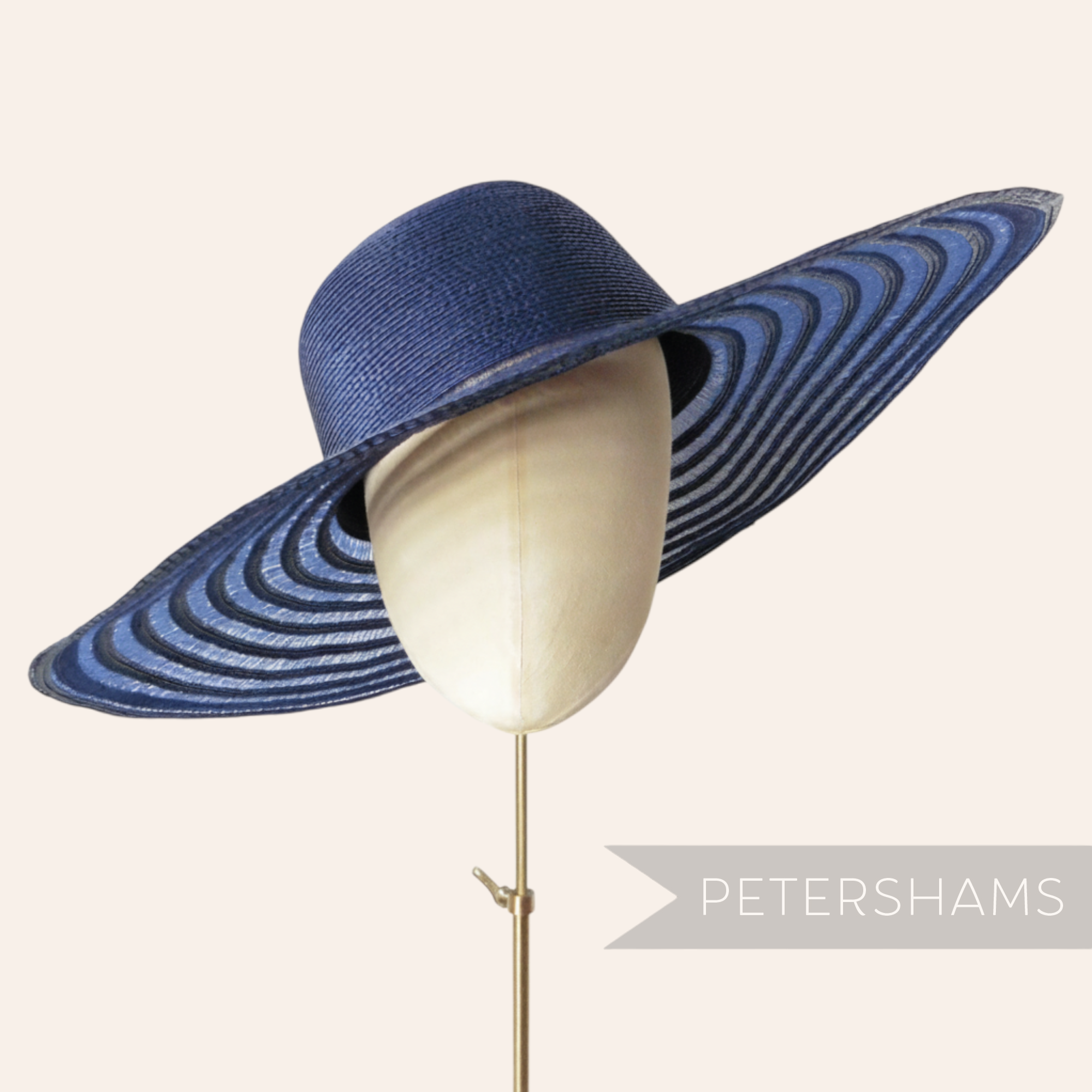 Petershams Millinery Supplies navy blue polybraid capeline hat body with a wide striped sheer crin brim