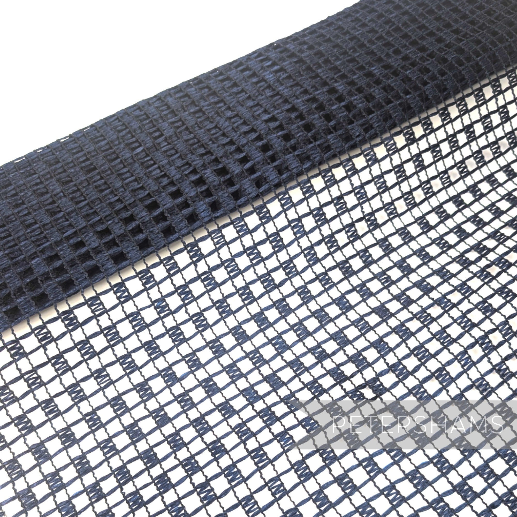 Petershams Millinery Supplies vintage Swiss navy blue laminated raffia mesh fabric with a checkerboard pattern.