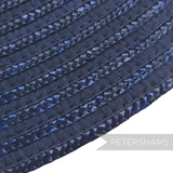 Close-up of a navy blue vintage Petershams Millinery Supplies hat base made from petersham ribbon and laichow straw.