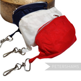 Petershams Millinery Supplies vintage nylon fold-up bucket hats in red, white, and navy with key chain storage bags.