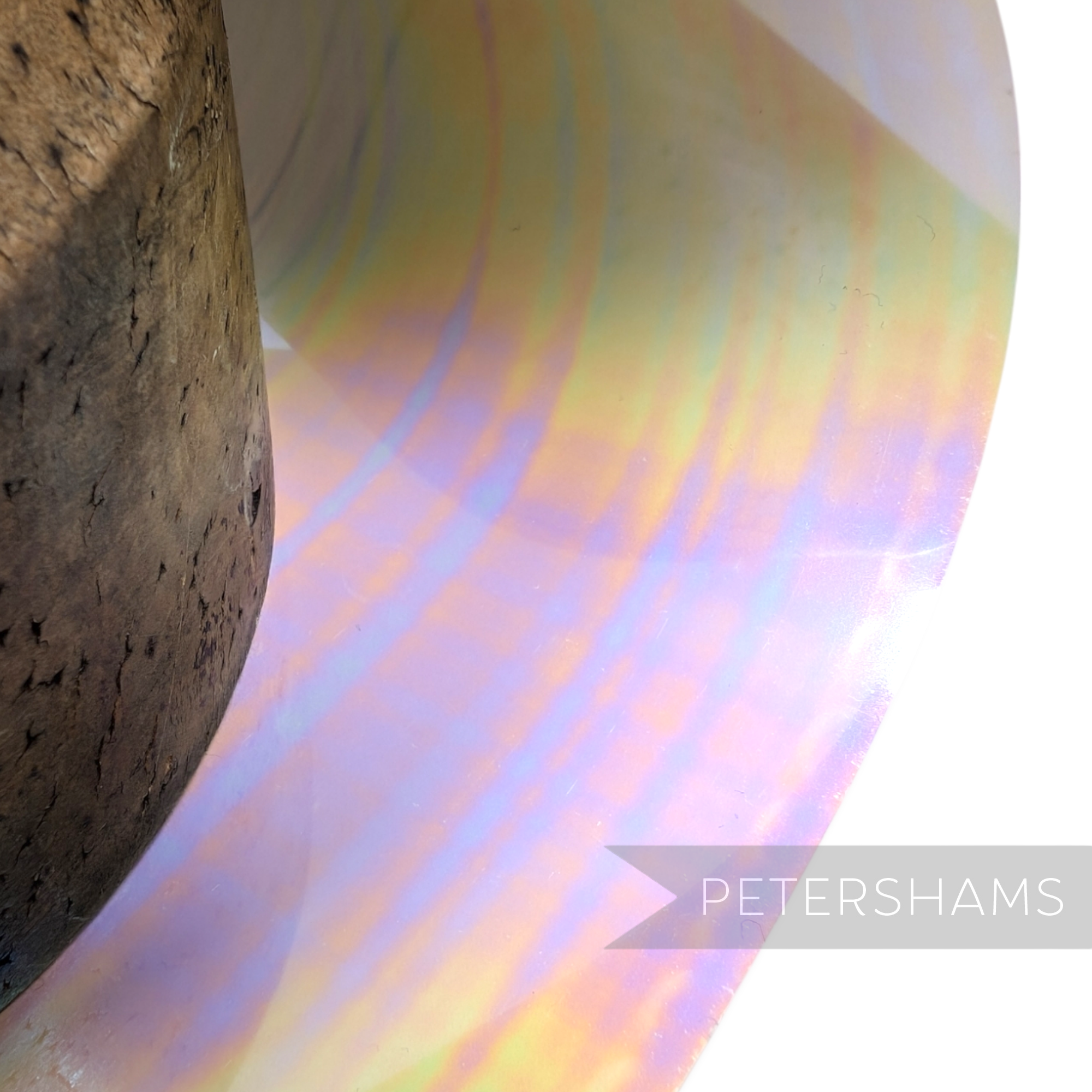 Petershams Millinery Supplies opaque oil slick sequin film with iridescent multi-colour sheen on a white base