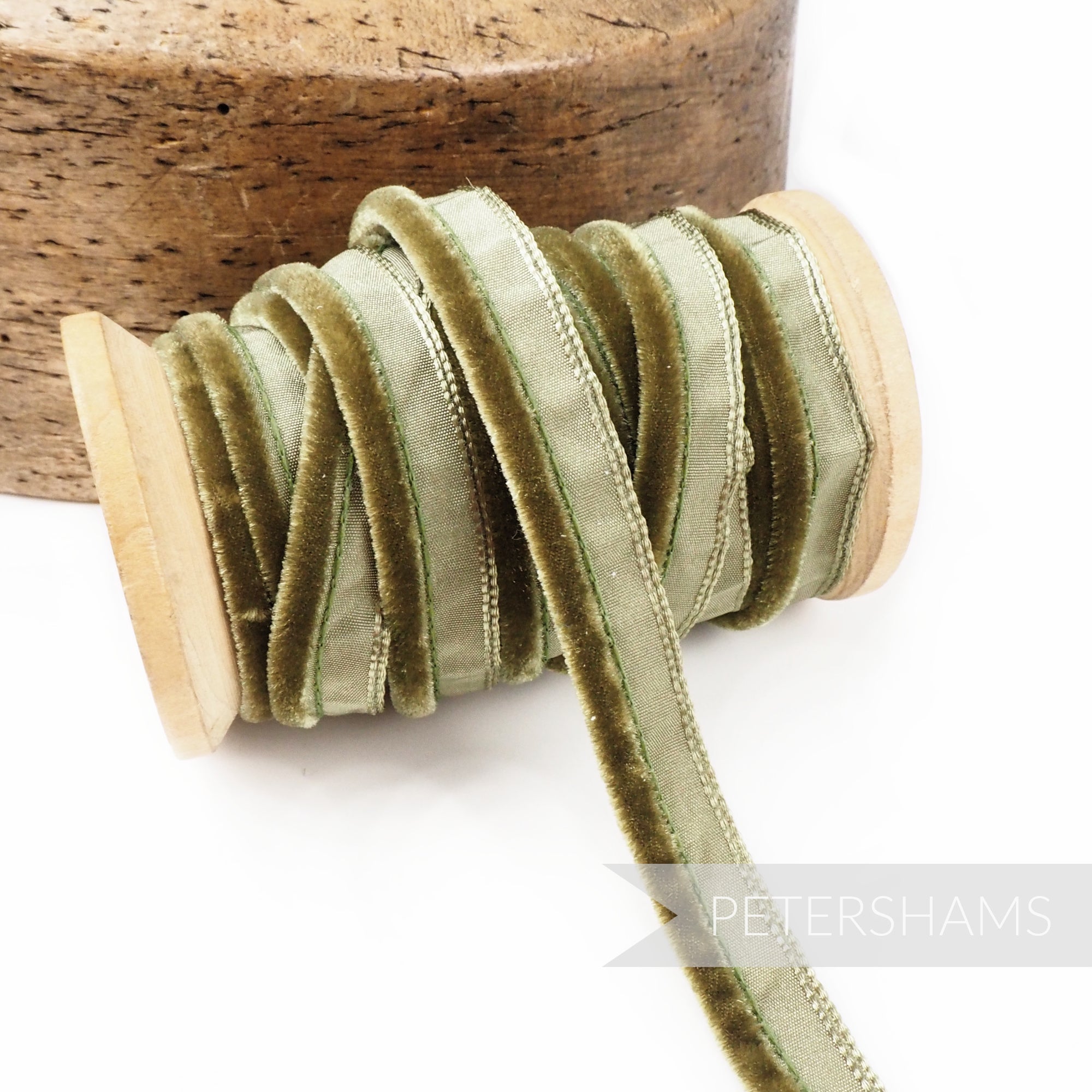 Petershams Millinery Supplies olive green 5mm velvet insertion piping cord on a wooden spool for sewing and millinery.