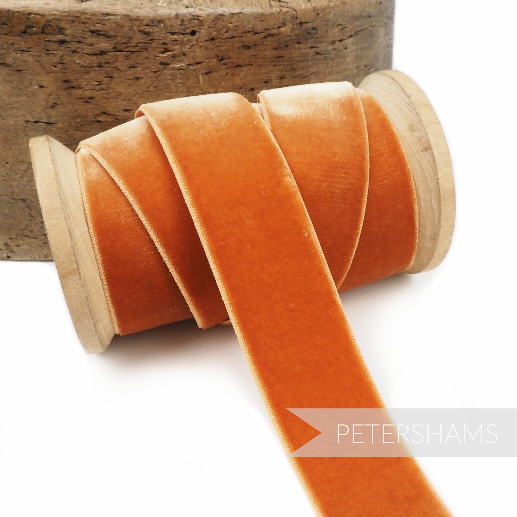 Petershams Millinery Supplies 23mm orange elastic stretch velvet ribbon on a wooden spool for millinery projects