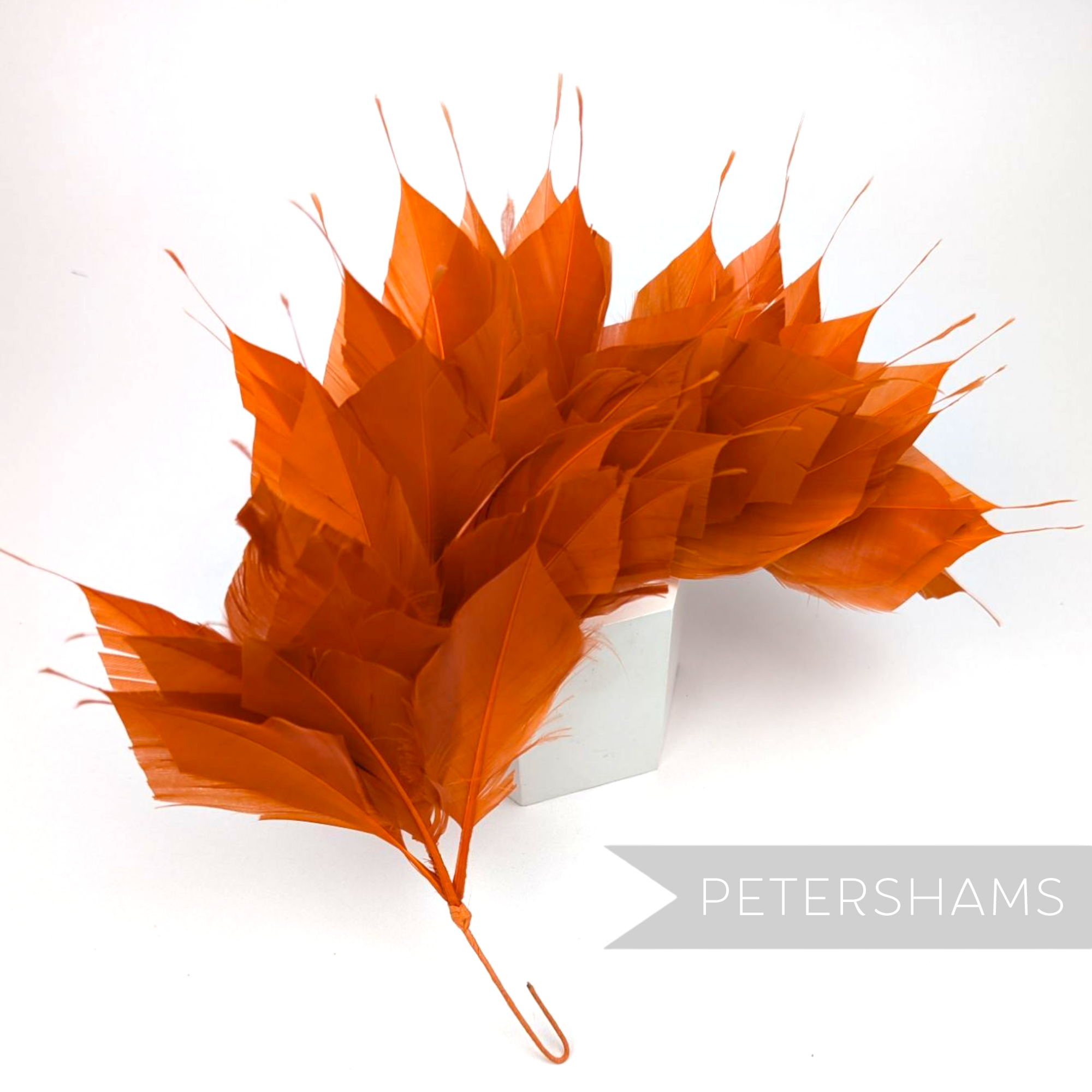 Petershams Millinery Supplies large burnt orange spiky goose feather wired millinery mount for hat making