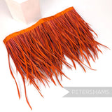 Petershams Millinery Supplies extra long burnt orange goose biot feather fringe on a stitched satin ribbon binding