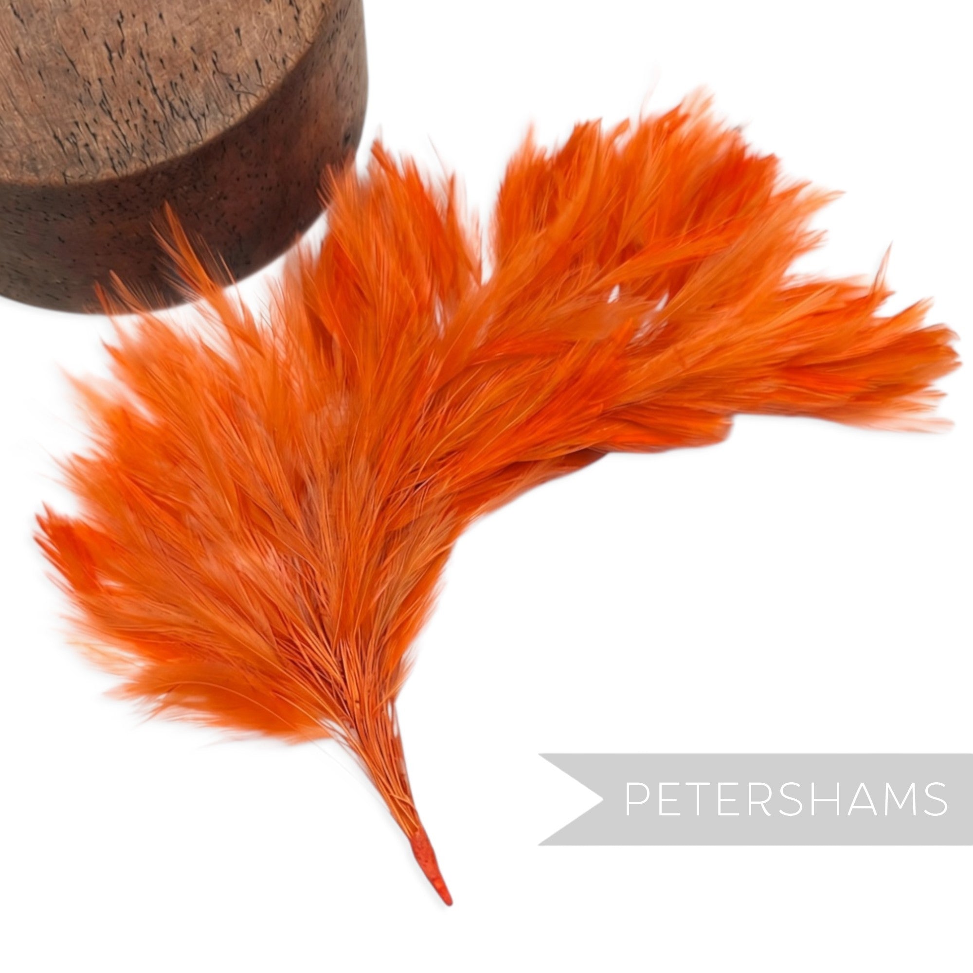 Petershams Millinery Supplies large orange stripped hackle feather mount on a wired stem for hat decoration