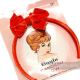 Petershams Millinery Supplies vintage 1960s orange velvet bandeau headband with a central bow on original packaging