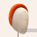 Petershams Millinery Supplies orange velvet 40mm super padded headband on a millinery display head