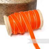Petershams Millinery Supplies 10mm orange vintage rayon velvet ribbon on a wooden spool