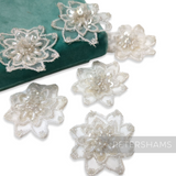 Petershams Millinery Supplies set of five white organza flower motifs with intricate bead and sequin embellishments.