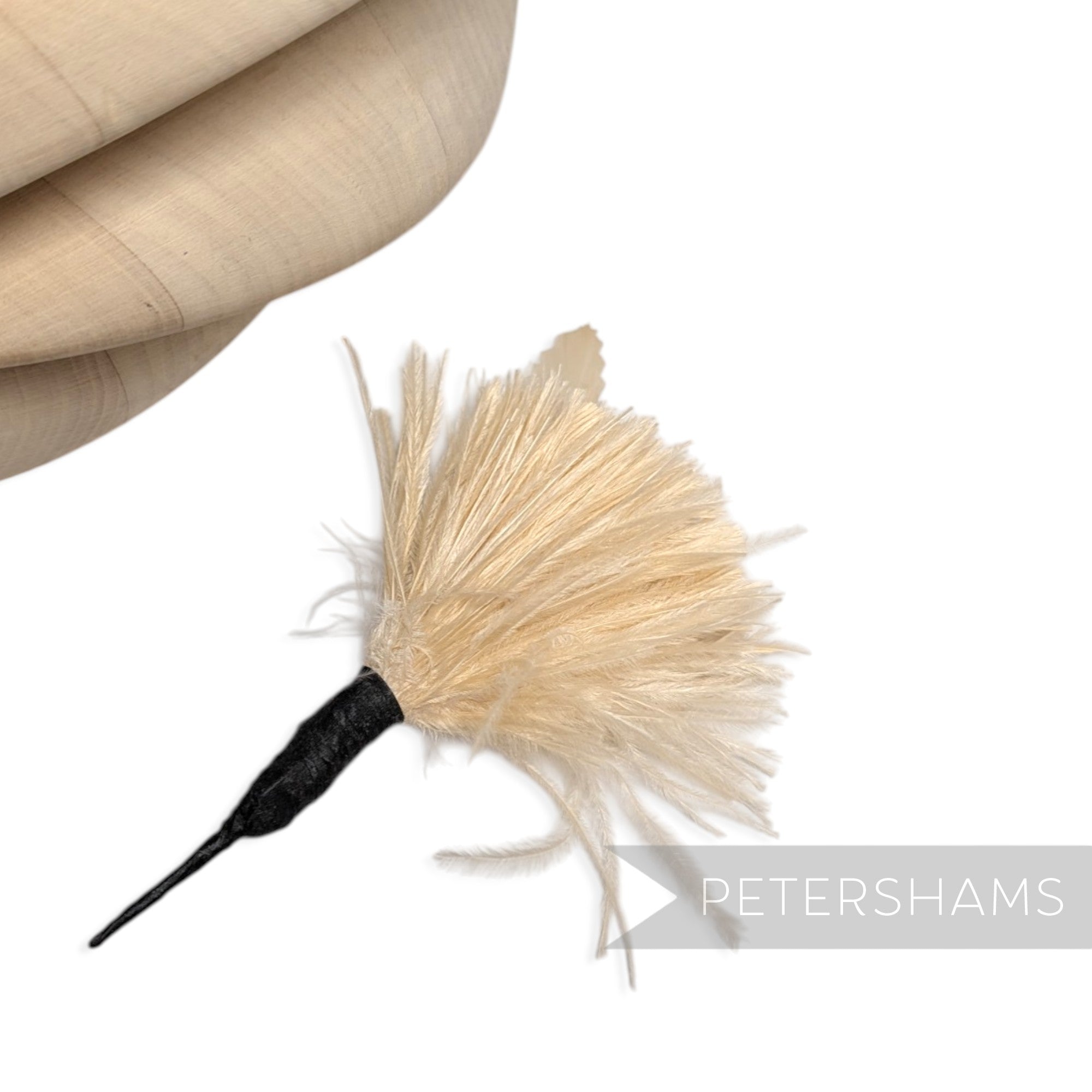 Petershams Millinery Supplies cream ostrich and goose feather hat mount with a black wired stem for fascinators
