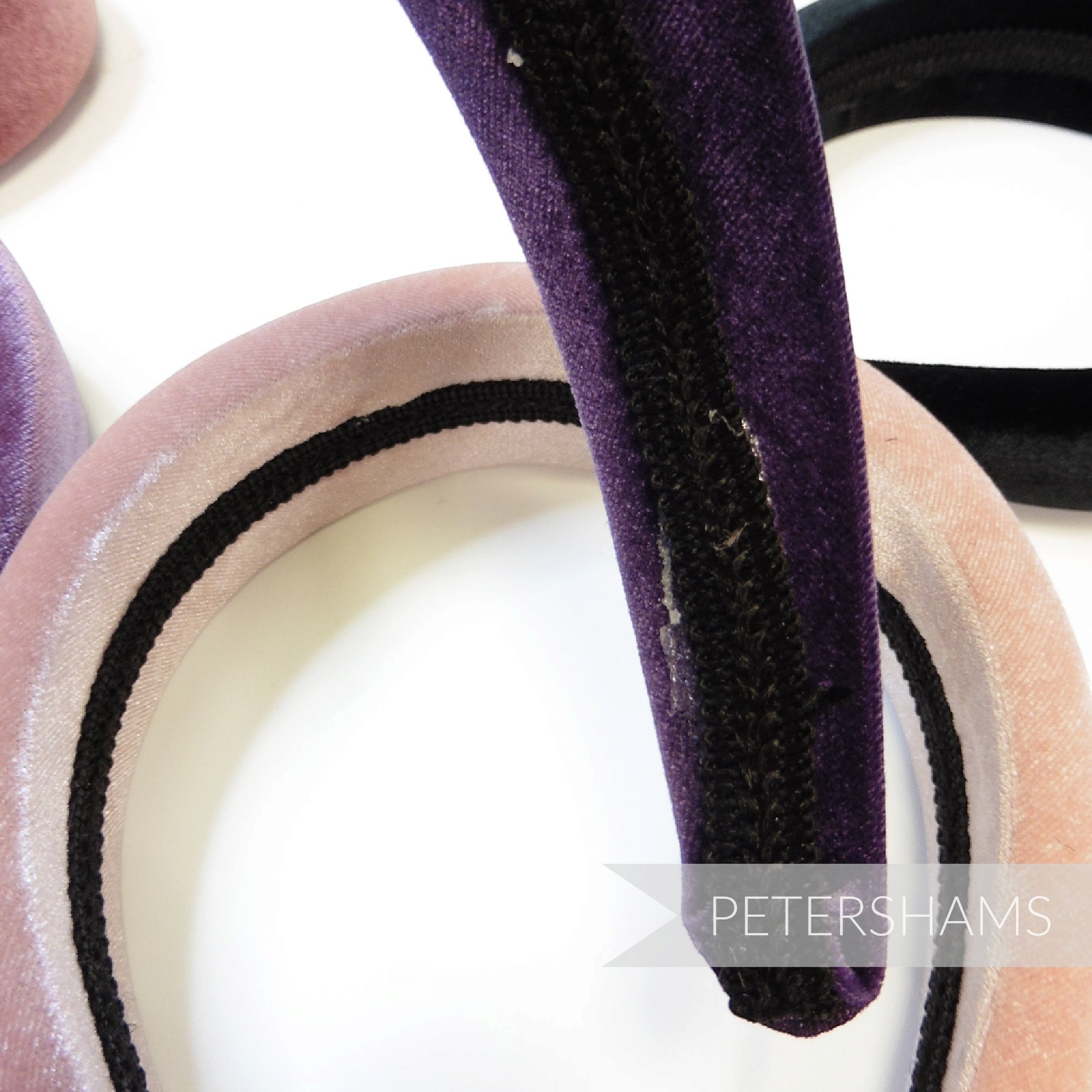 Petershams Millinery Supplies assorted 40mm padded headbands in velvet, featuring purple and pink colours.