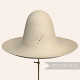 Petershams Millinery Supplies vintage Ecuador Panama straw capeline hat body with a decorative X vent design.