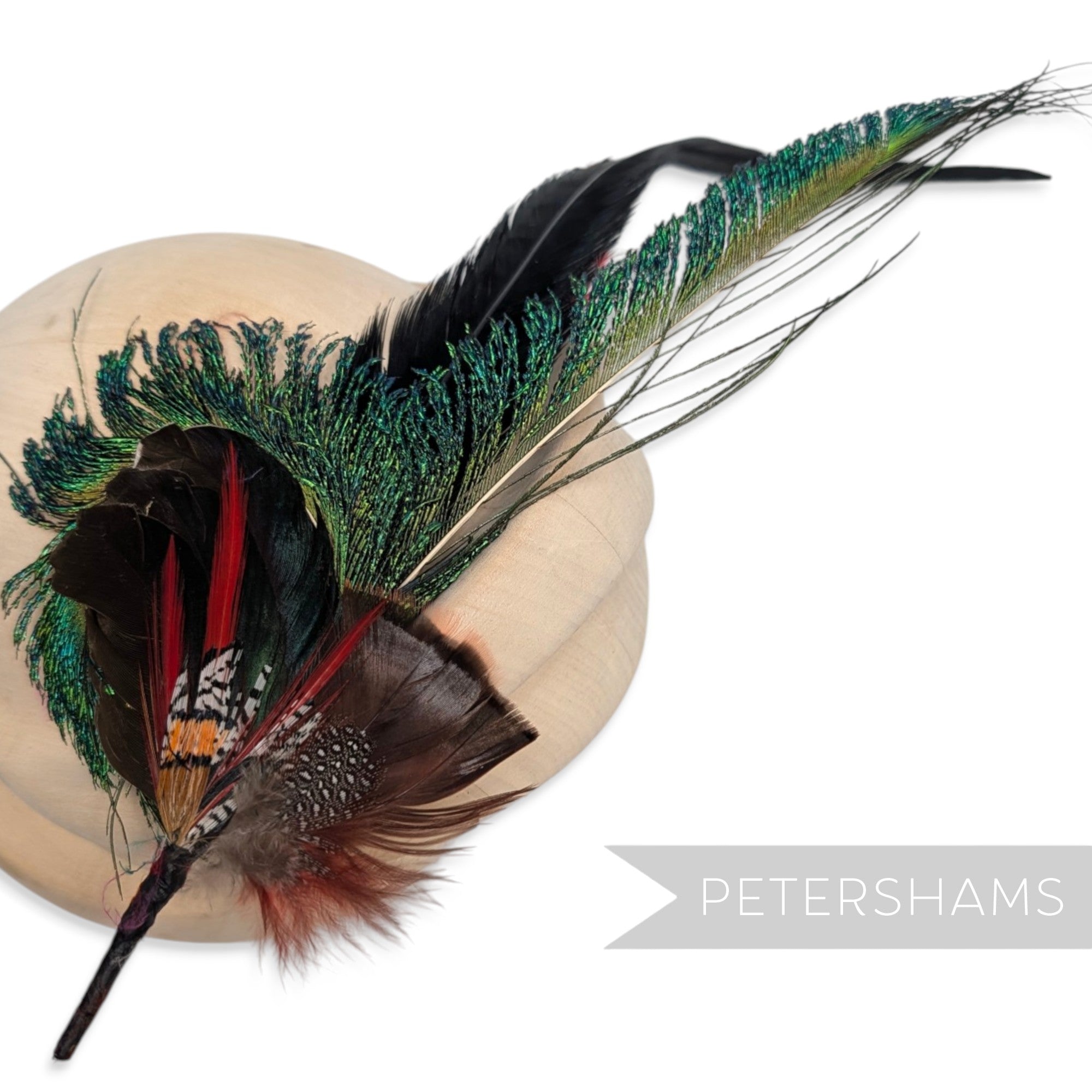 Petershams Millinery Supplies Terrance hat mount featuring peacock, pheasant, and turkey feathers