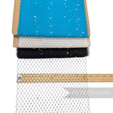 Petershams Millinery Supplies ivory pearl embellished veiling fabric rolls in blue, white, and black with ruler