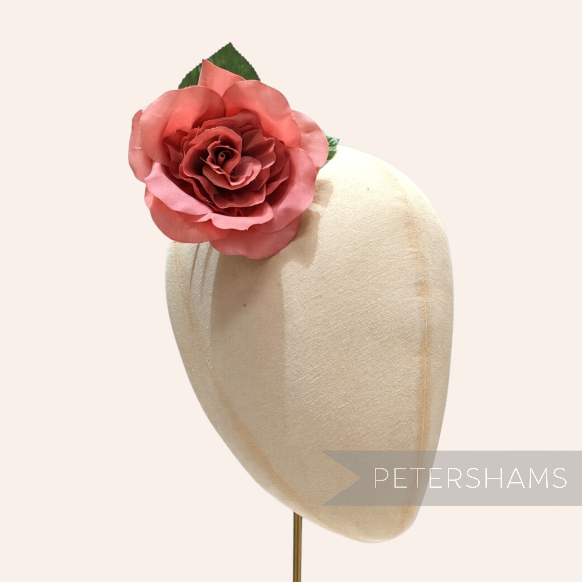 Petershams Millinery Supplies Annie small pink fabric camellia flower with green leaves on a wired stem