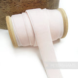 Petershams Millinery Supplies 23mm pale pink elastic stretch velvet ribbon on a wooden spool