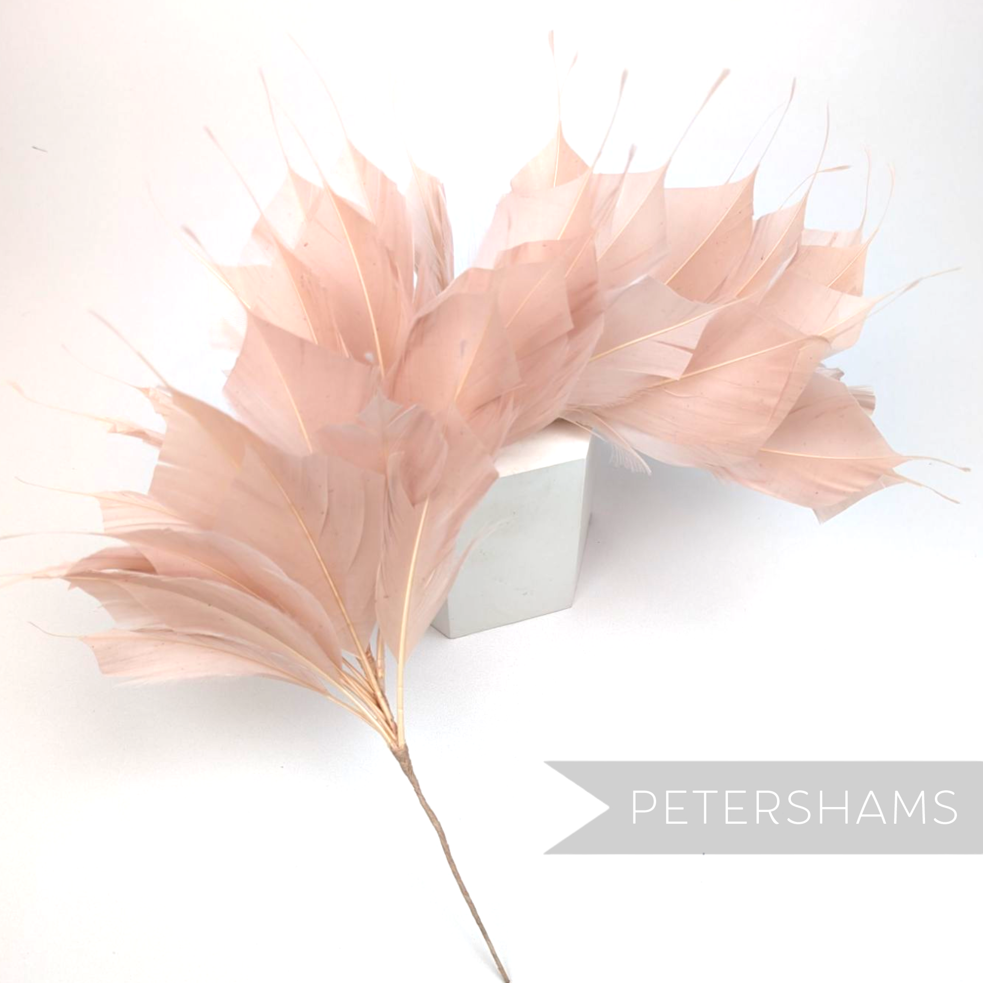 Petershams Millinery Supplies large spiky rose pink goose feather hat mount on a wired stem for millinery projects.