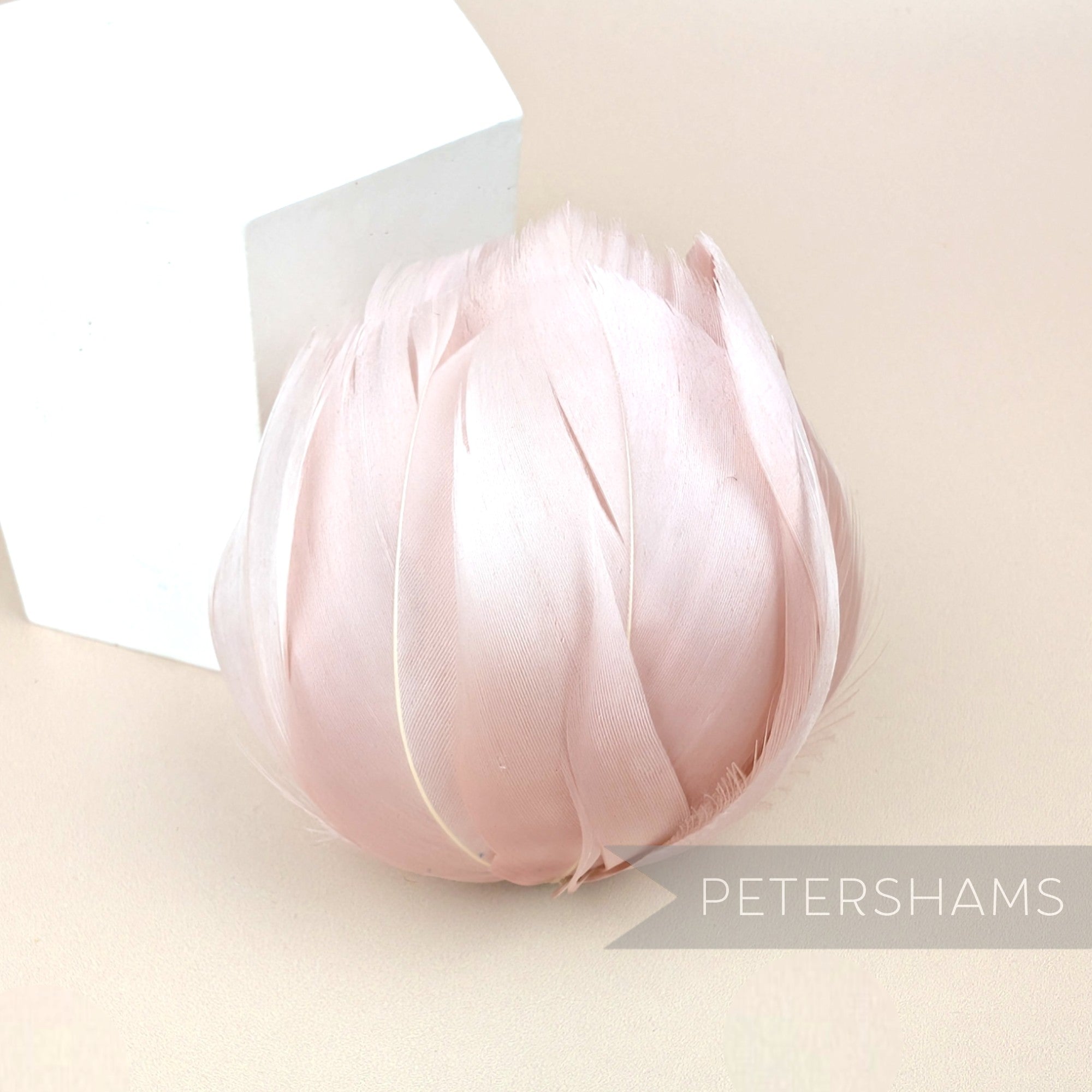 Petershams Millinery Supplies large blush pink tulip shaped flower made from cupped goose nagorie feathers.